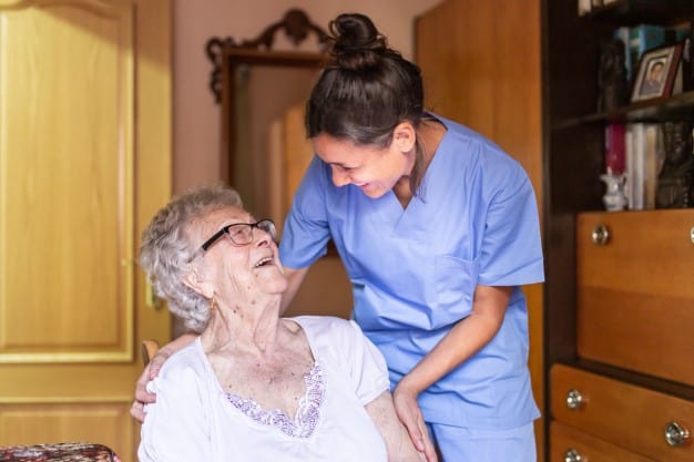 home care elderly talking with caregiver